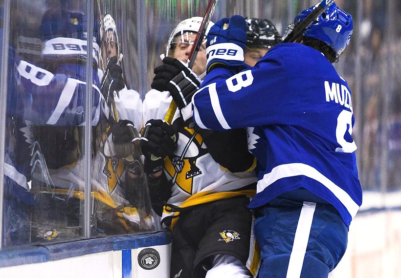 Some of the crowd gets a great view as referees separate Flyers' Andre  DuPont (6) and Toronto Maple Leafs' Dave Williams (22) during pulling match  late in the first period of playoff